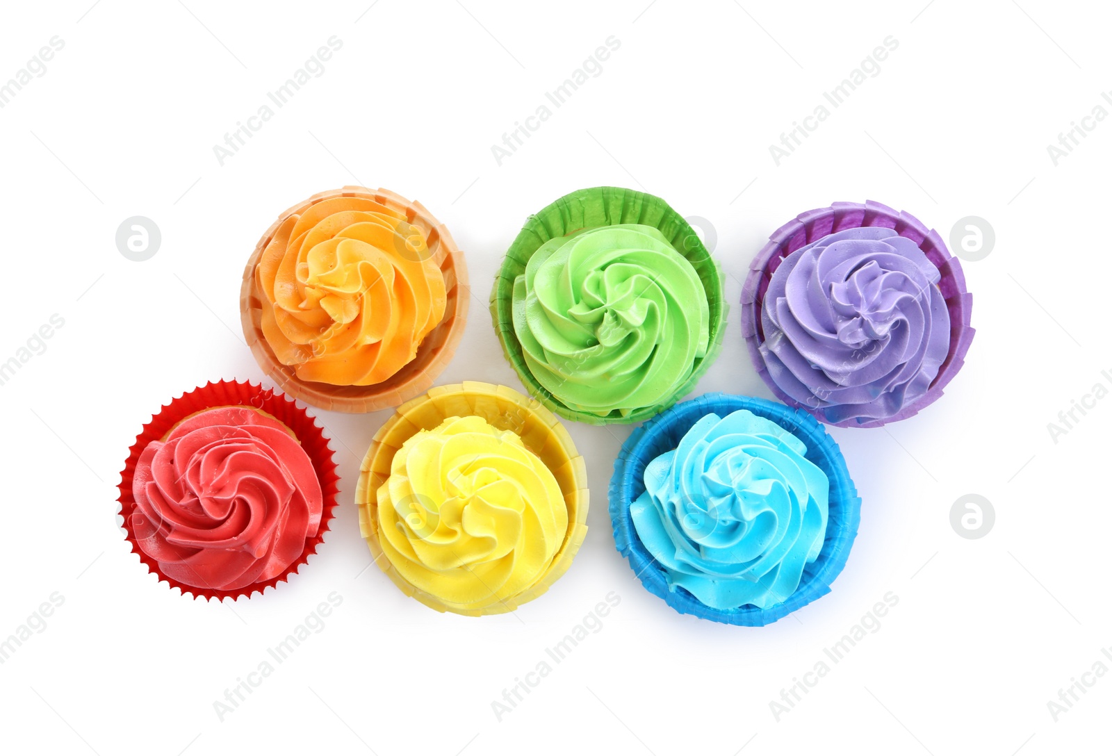 Photo of Tasty cupcakes with bright cream isolated on white, top view