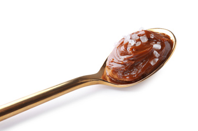 Photo of Salted caramel in spoon isolated on white