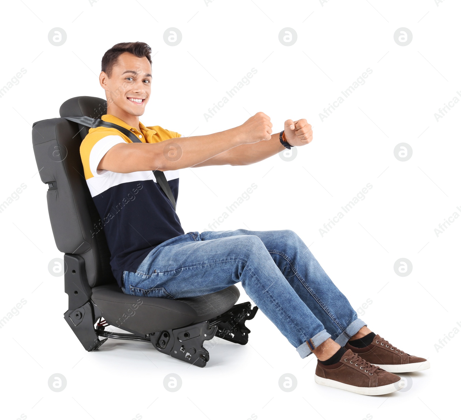 Photo of Young man sitting in car seat with safety belt on white background