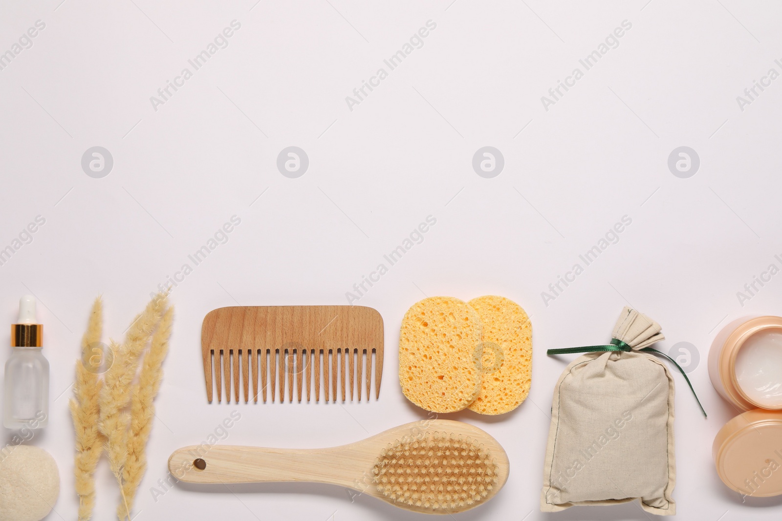 Photo of Bath accessories. Different personal care products and dry spikelets on white background, flat lay with space for text