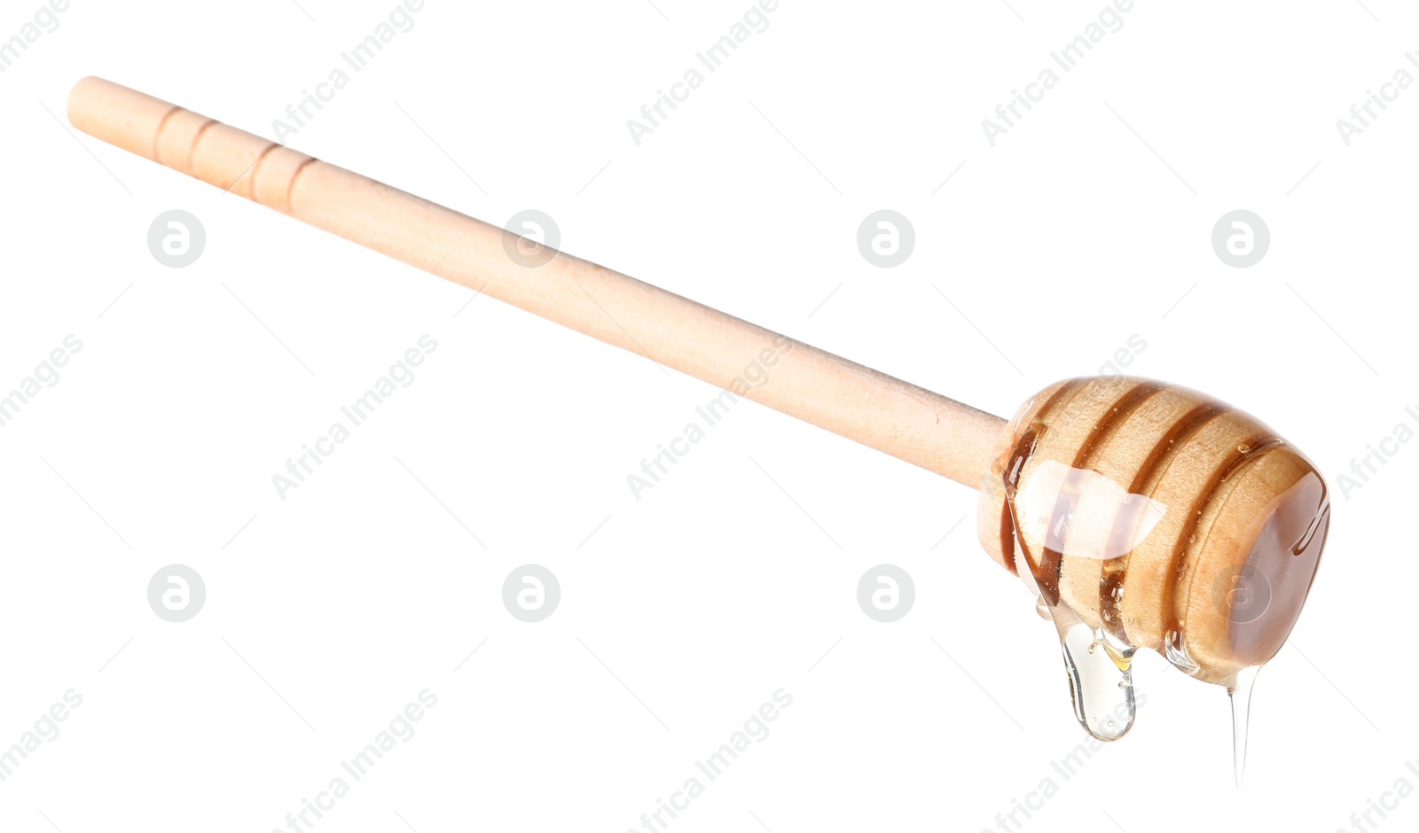 Photo of Natural honey dripping from dipper on white background