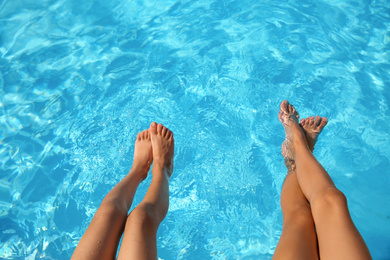 Photo of Children in swimming pool on sunny day, closeup