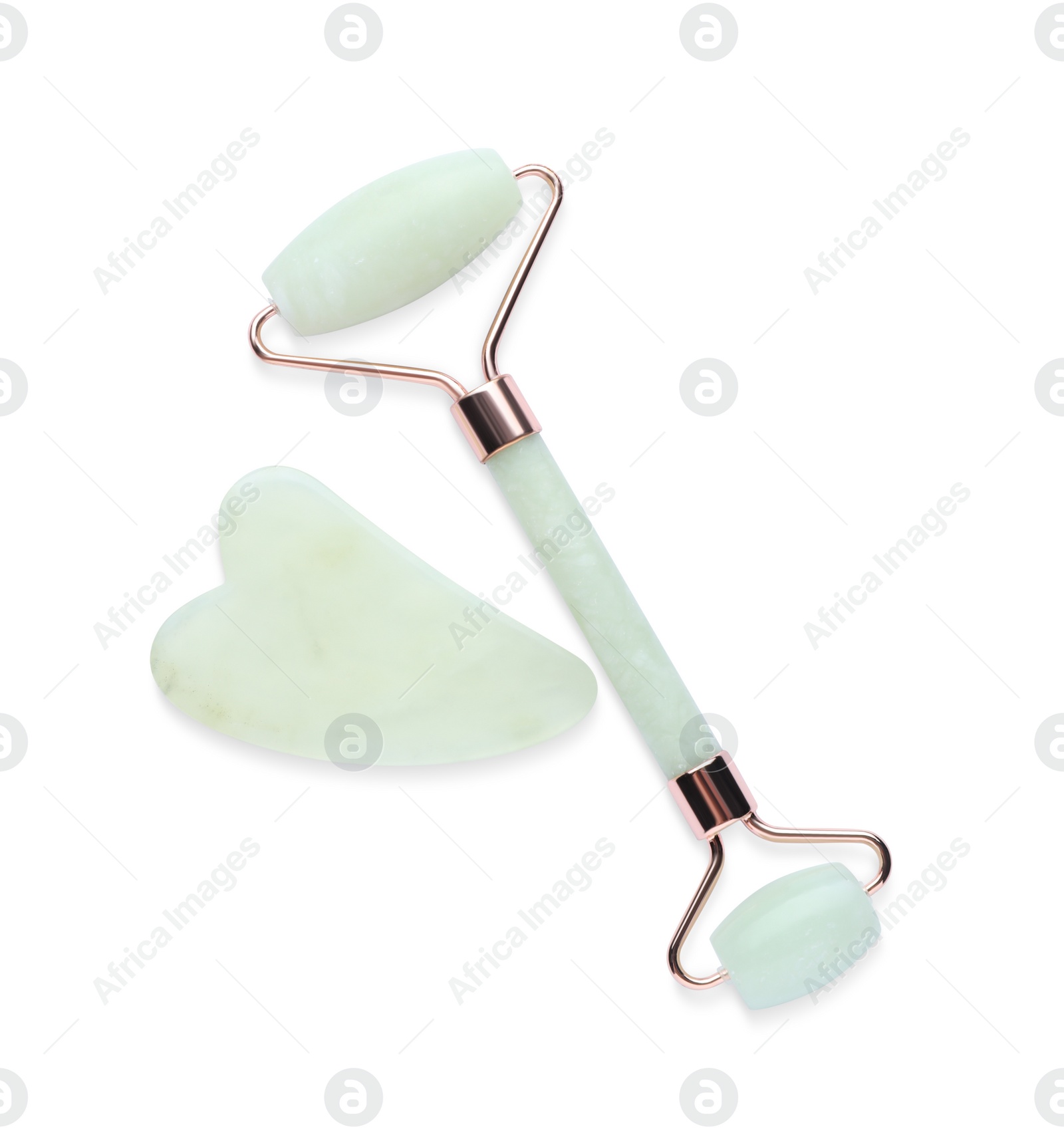 Photo of Jade gua sha tool and facial roller isolated on white, top view