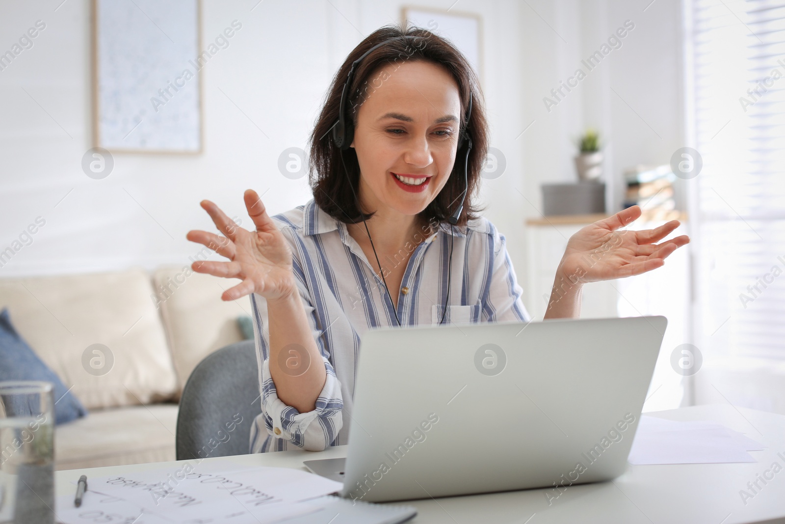 Photo of Teacher conducting online lesson at home during COVID-19 quarantine