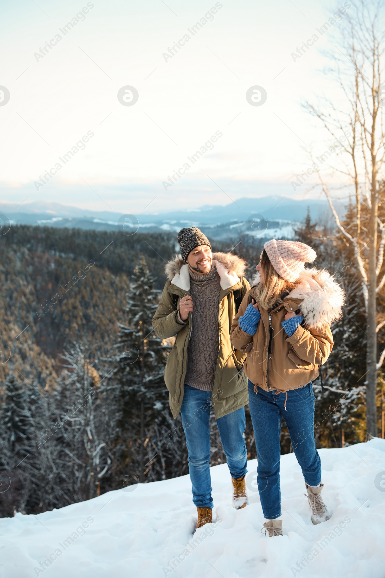 Photo of Happy couple spending winter vacation together in mountains