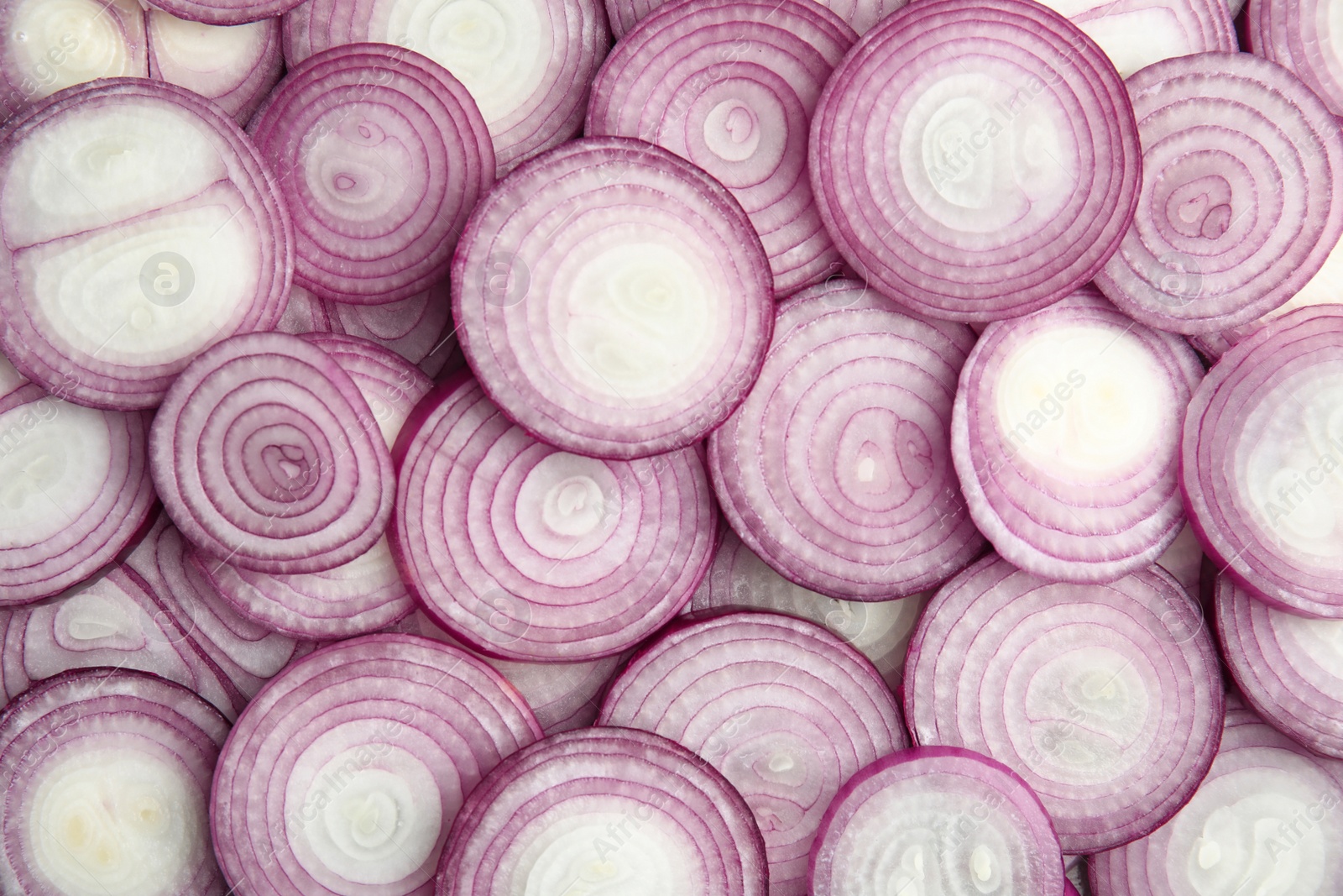 Photo of Ripe red onions as background