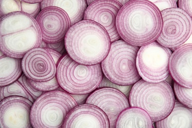 Photo of Ripe red onions as background