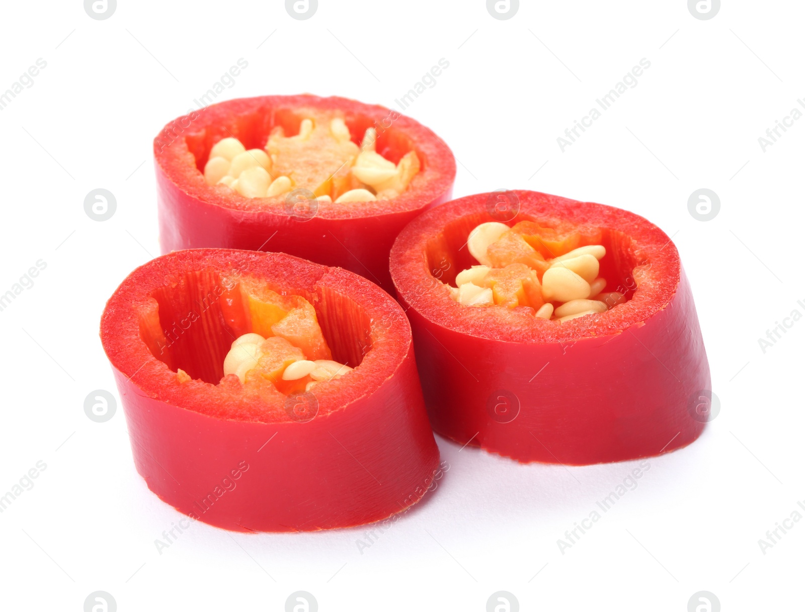 Photo of Slices of red chili pepper on white background