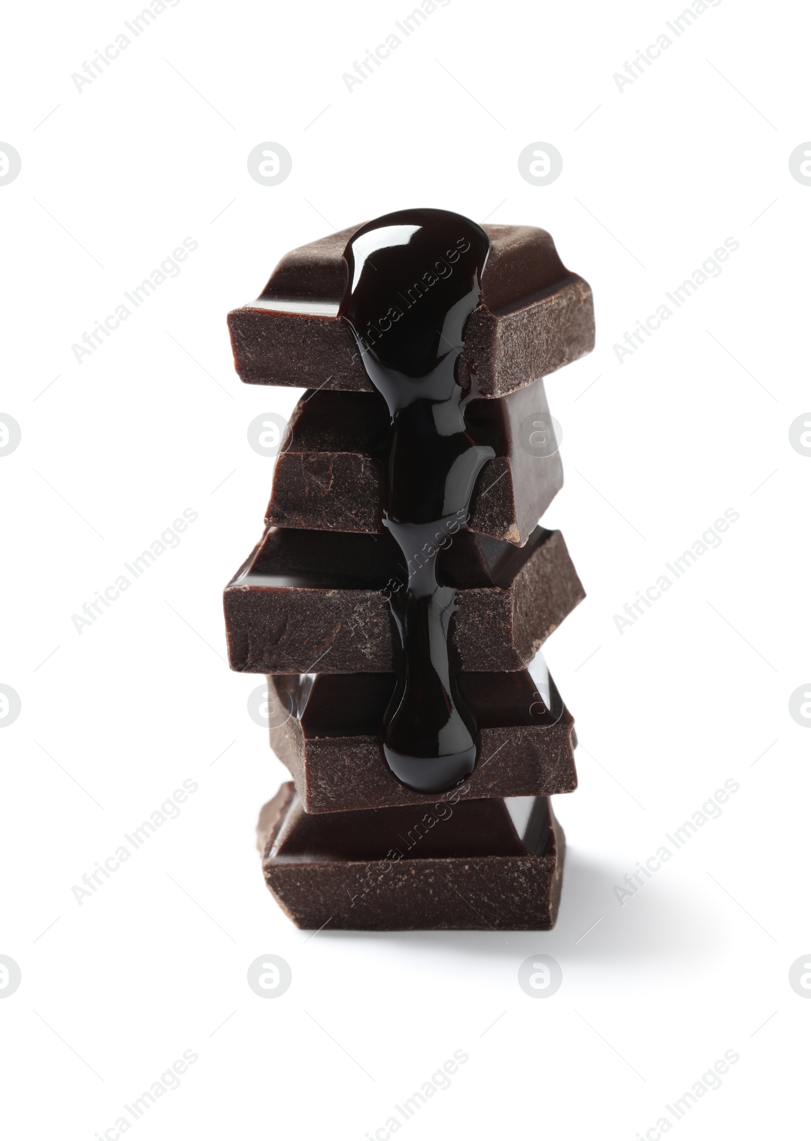 Photo of Pieces of delicious dark chocolate with syrup isolated on white