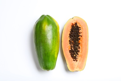 Photo of Fresh juicy ripe papayas on white background, top view