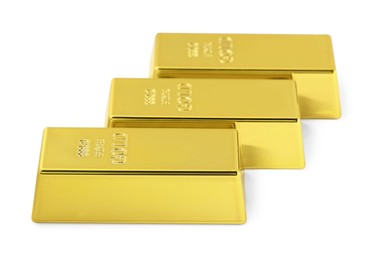 Photo of Three shiny gold bars isolated on white