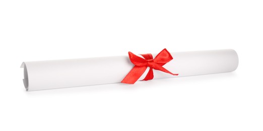 Photo of Rolled student's diploma with red ribbon isolated on white