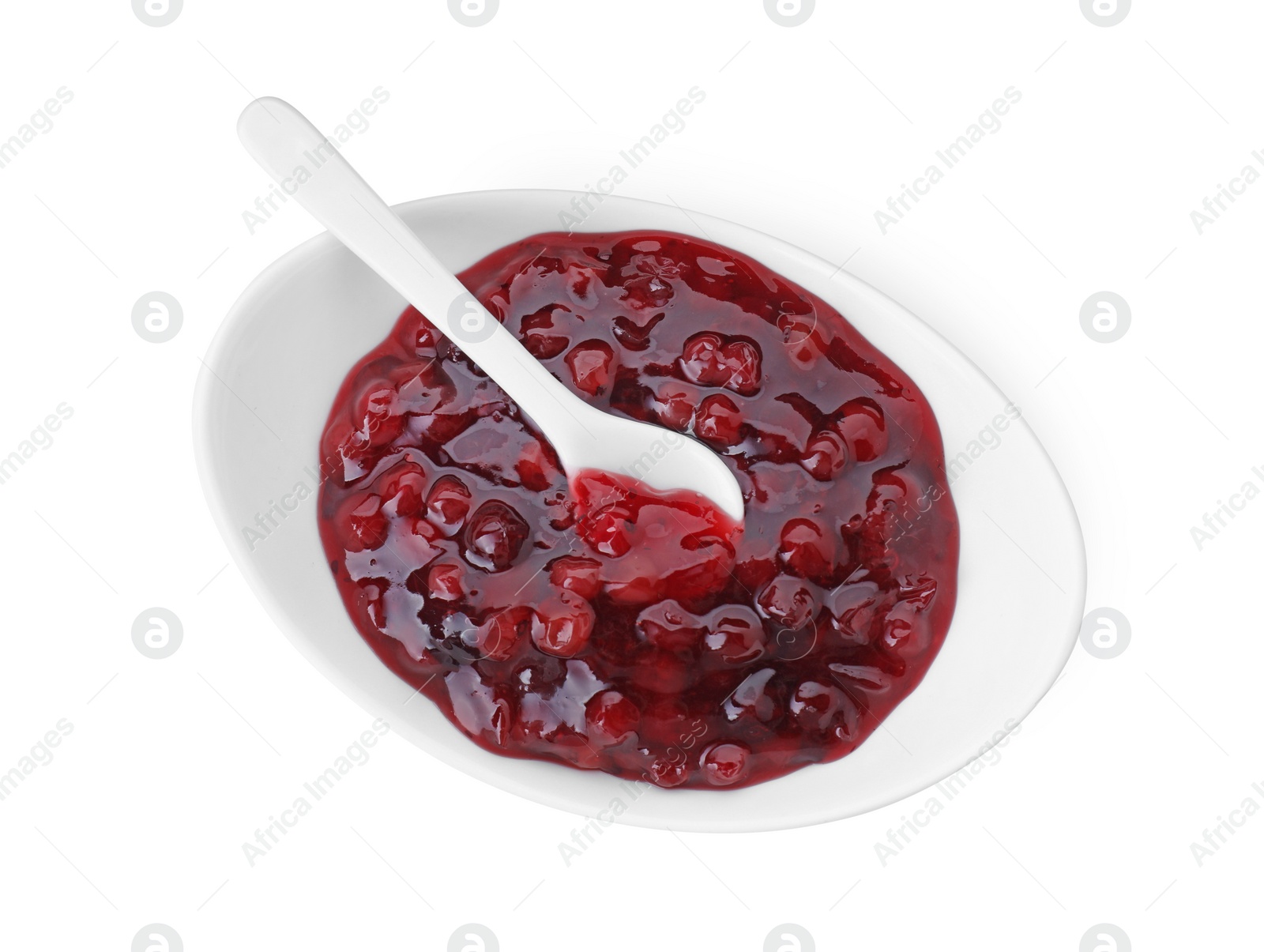 Photo of Fresh cranberry sauce in bowl isolated on white, top view