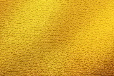 Image of Golden textured surface as background, closeup view