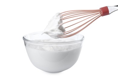 Photo of Bowl with whipped cream and whisk isolated on white