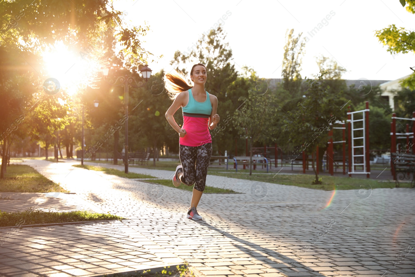 Photo of Young woman on morning run in park