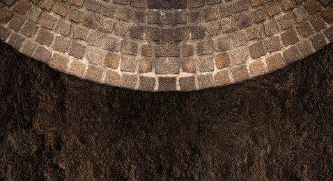 Image of Stone tiled surface and ground outdoors, top view