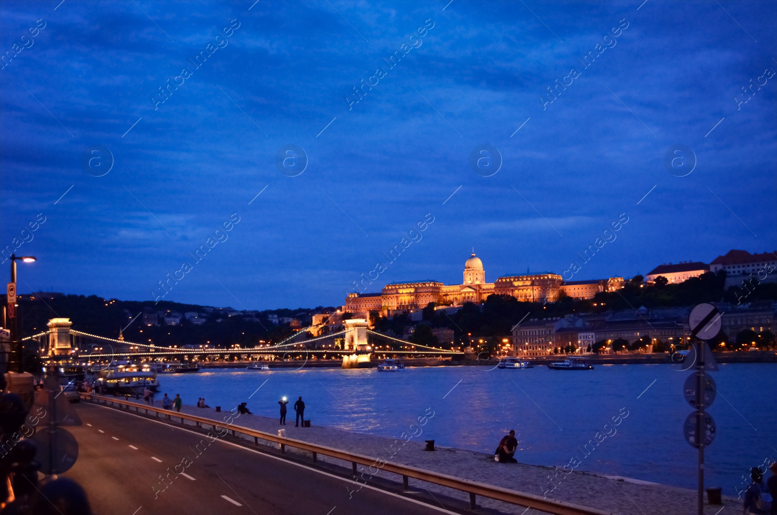 Photo of BUDAPEST, HUNGARY - JUNE 17, 2018: Picturesque view of Danube river, Chain Bridge and Royal Palace in evening