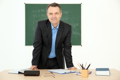 Photo of Portrait of male teacher in classroom