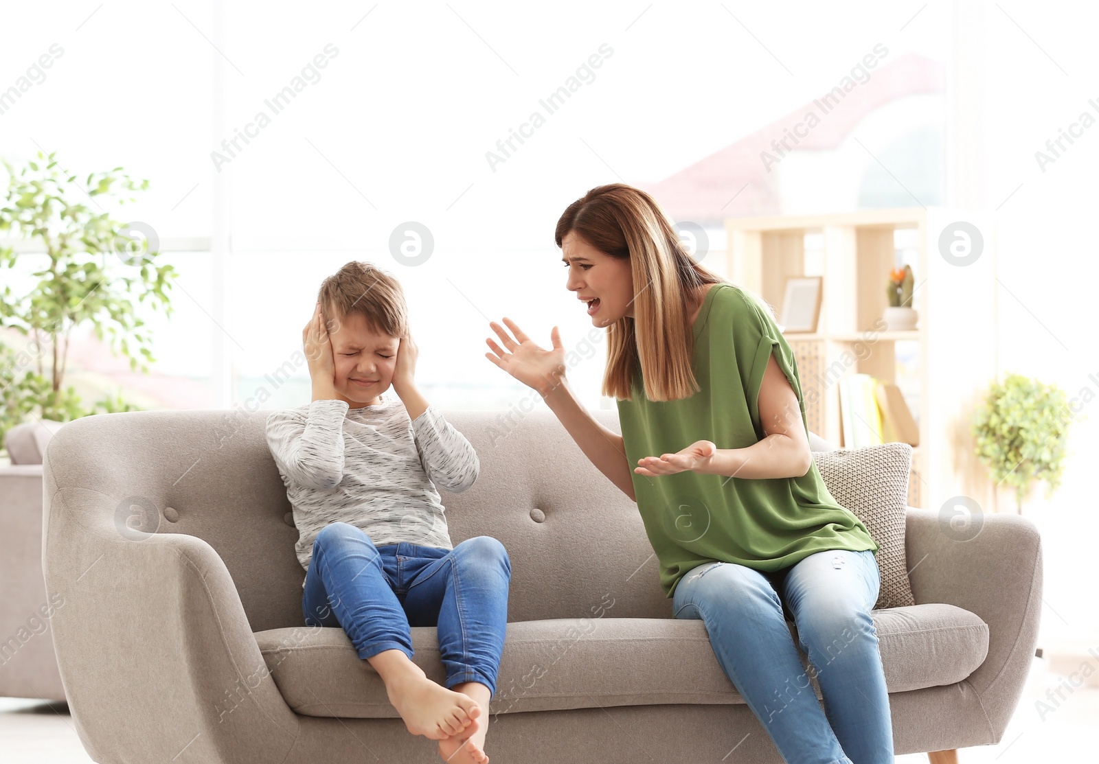 Photo of Mother arguing with son at home