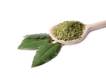 Photo of Spoon with ground and fresh bay leaves on white background