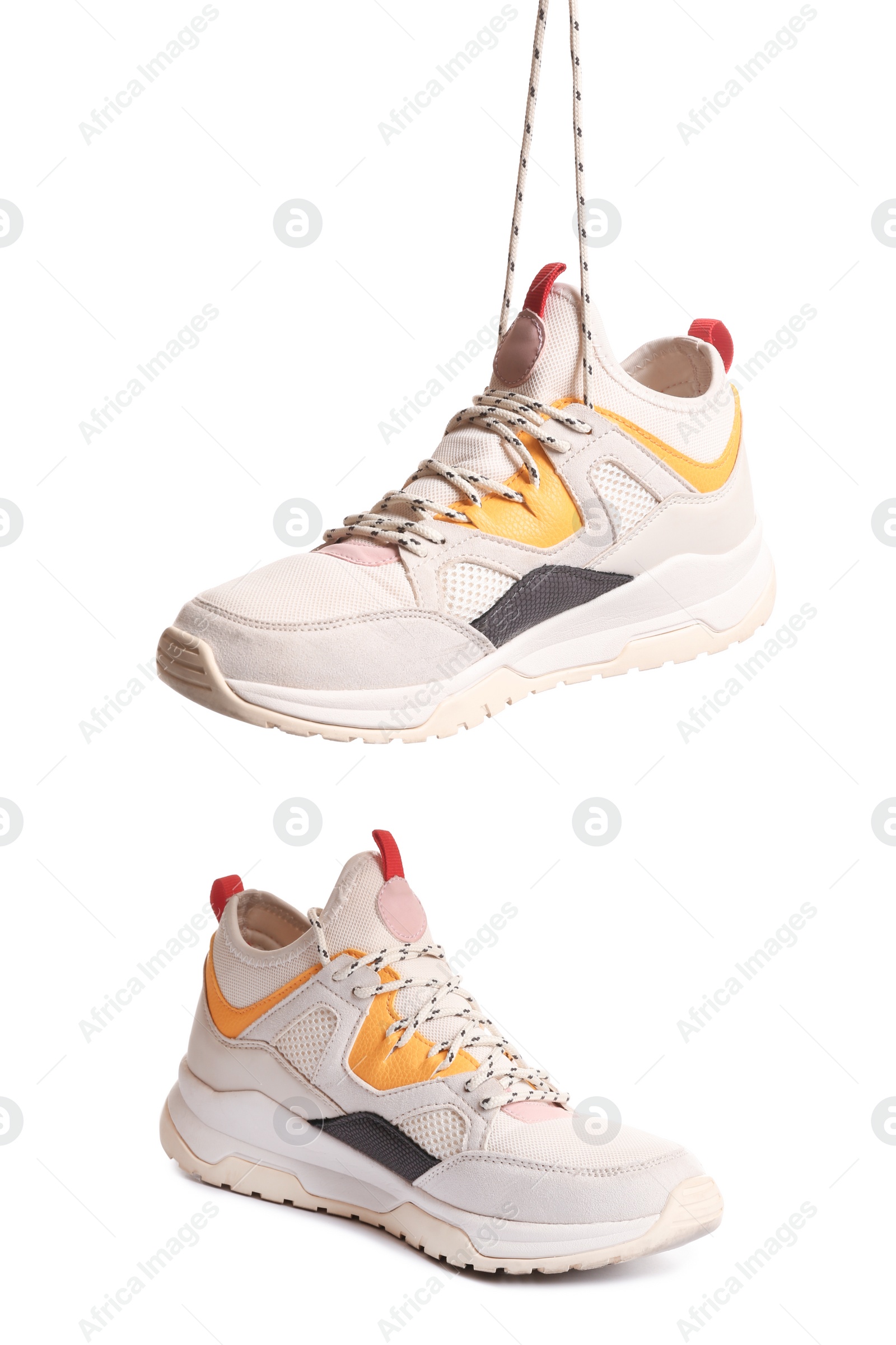 Photo of Pair of sports shoes on white background