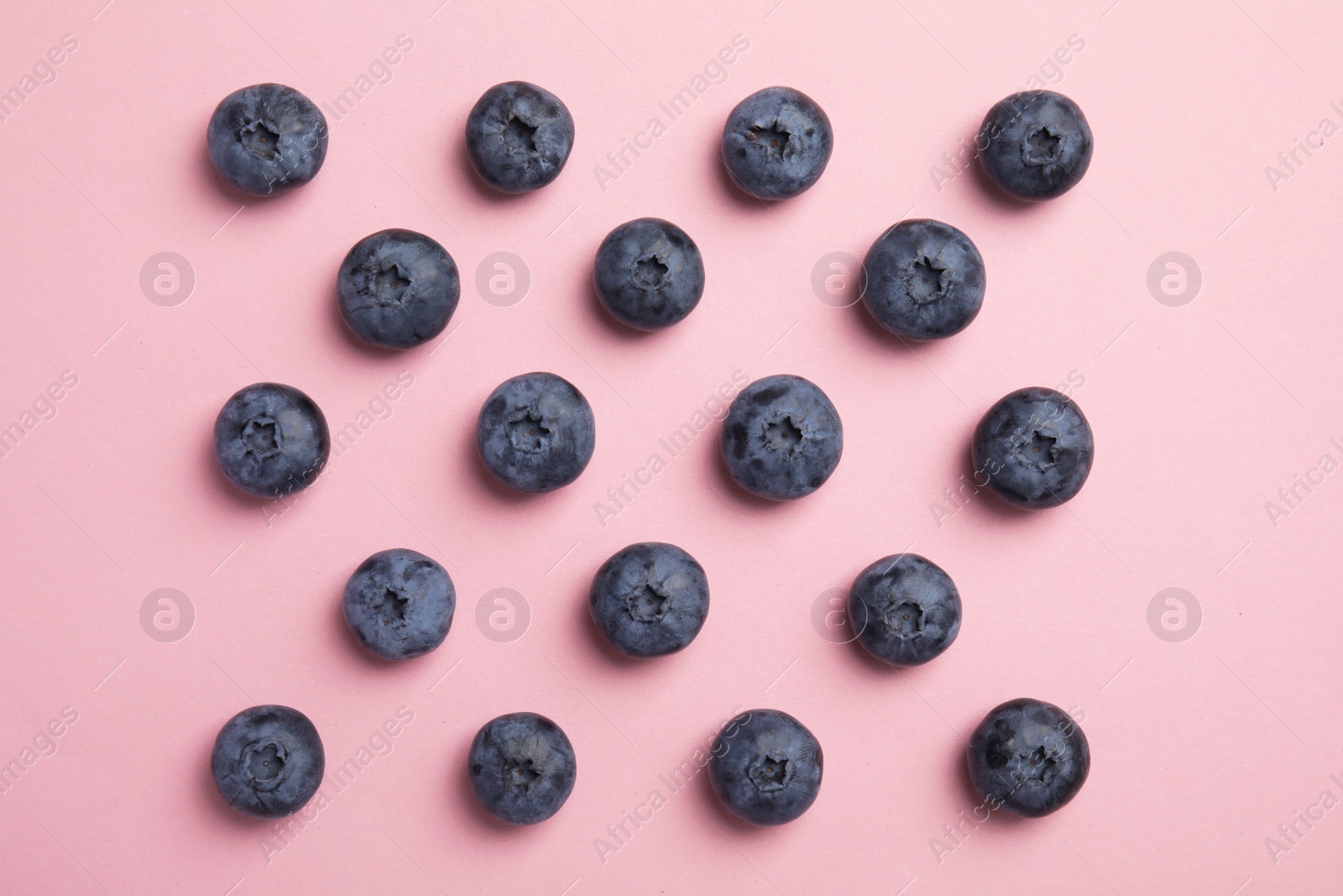 Photo of Flat lay composition with tasty blueberry on color background