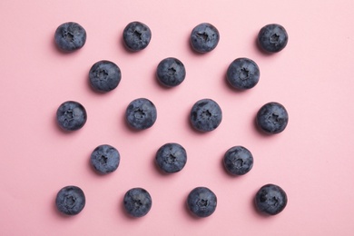 Flat lay composition with tasty blueberry on color background