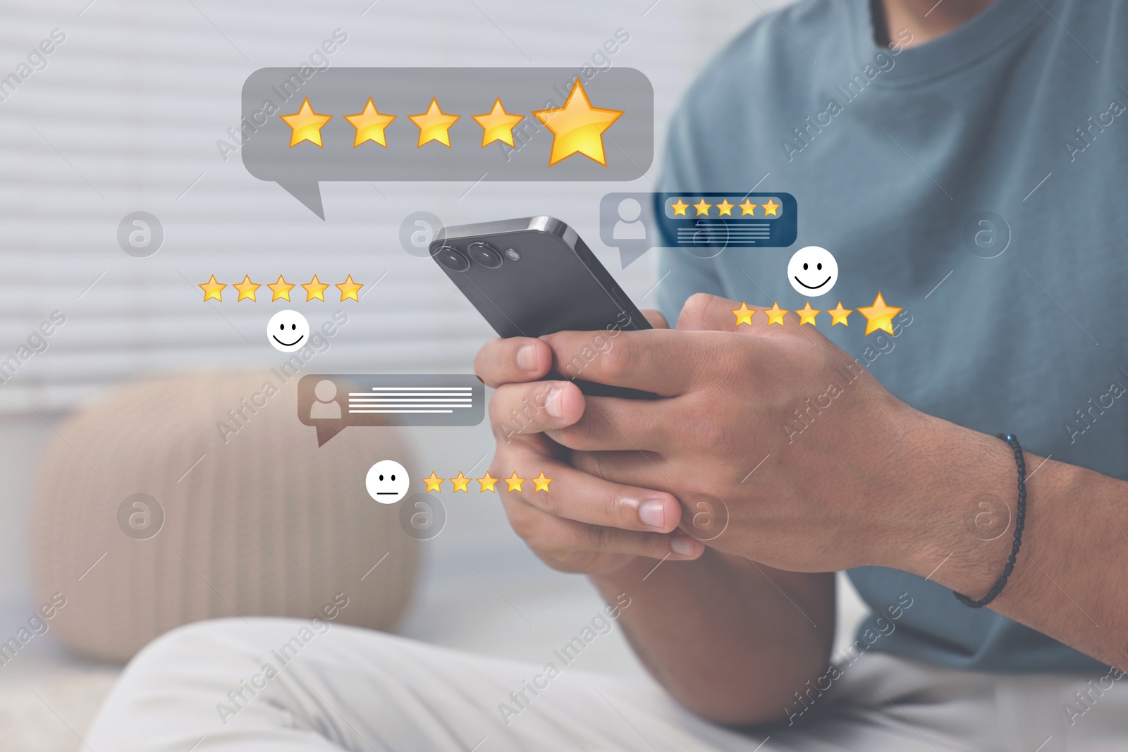 Image of Man leaving service feedback with smartphone at home, closeup. Stars and emoticons near device