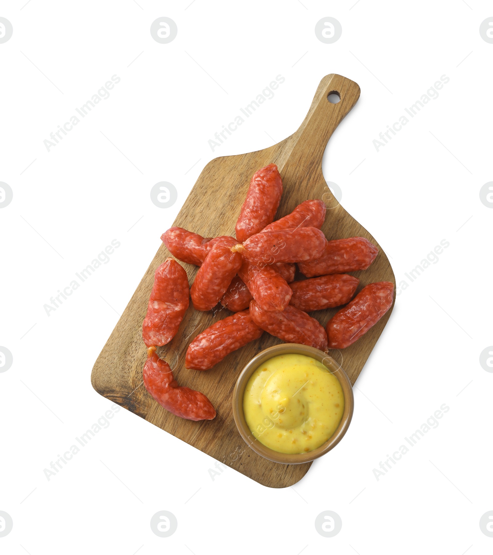 Photo of Many thin dry smoked sausages served with mustard isolated on white, top view