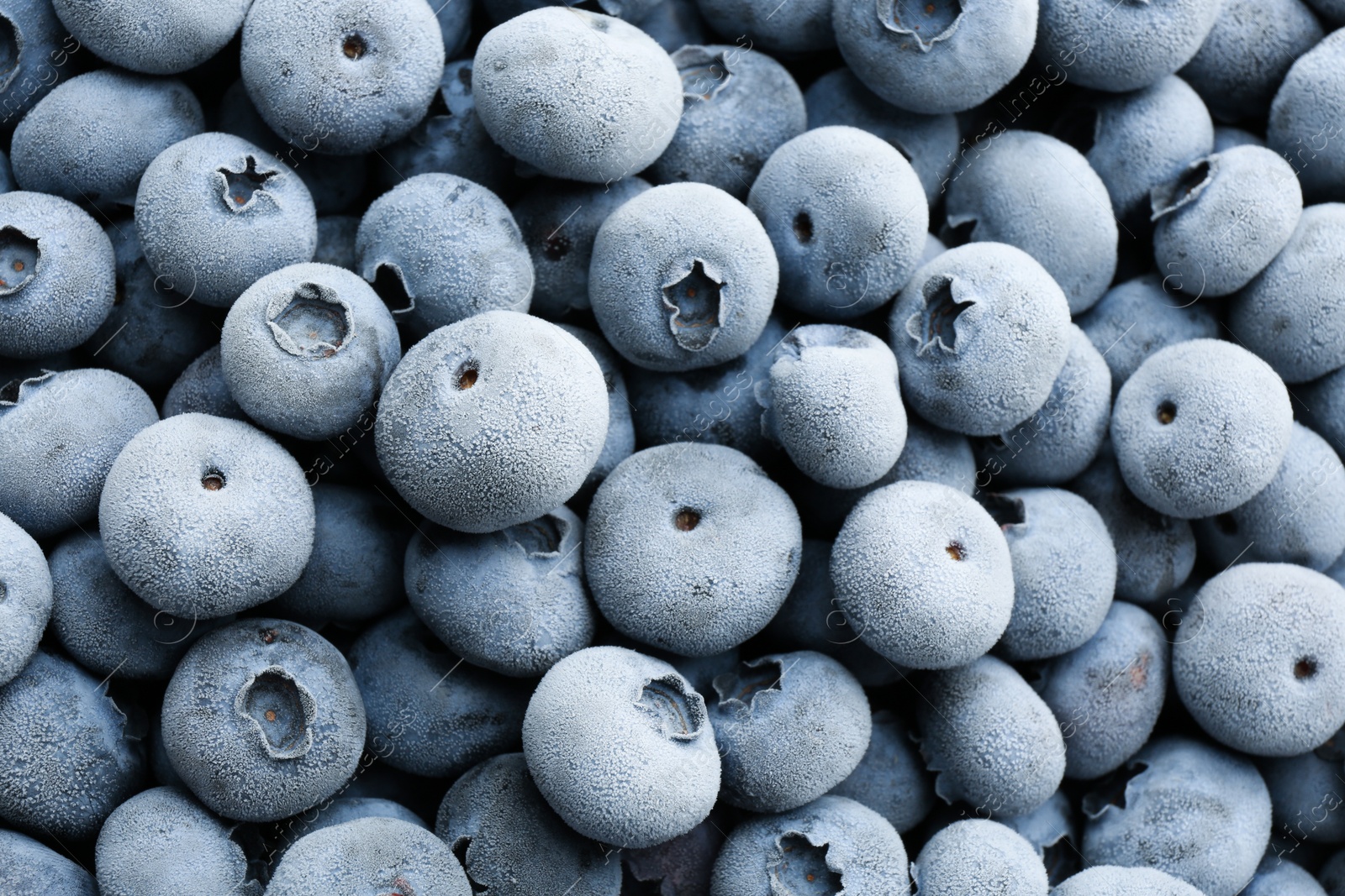 Photo of Tasty frozen blueberries as background, top view