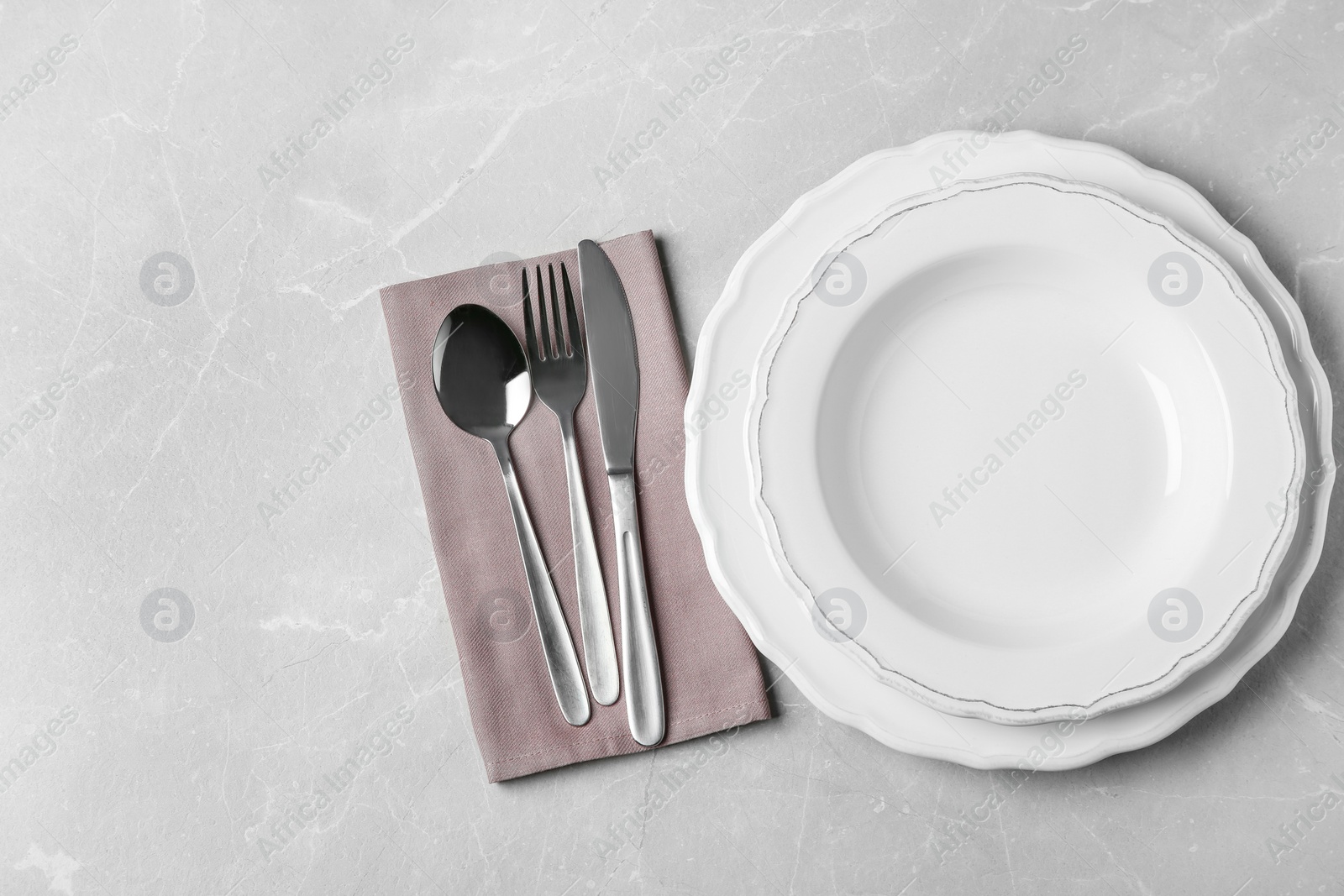 Photo of Beautiful table setting on grey marble background, flat lay