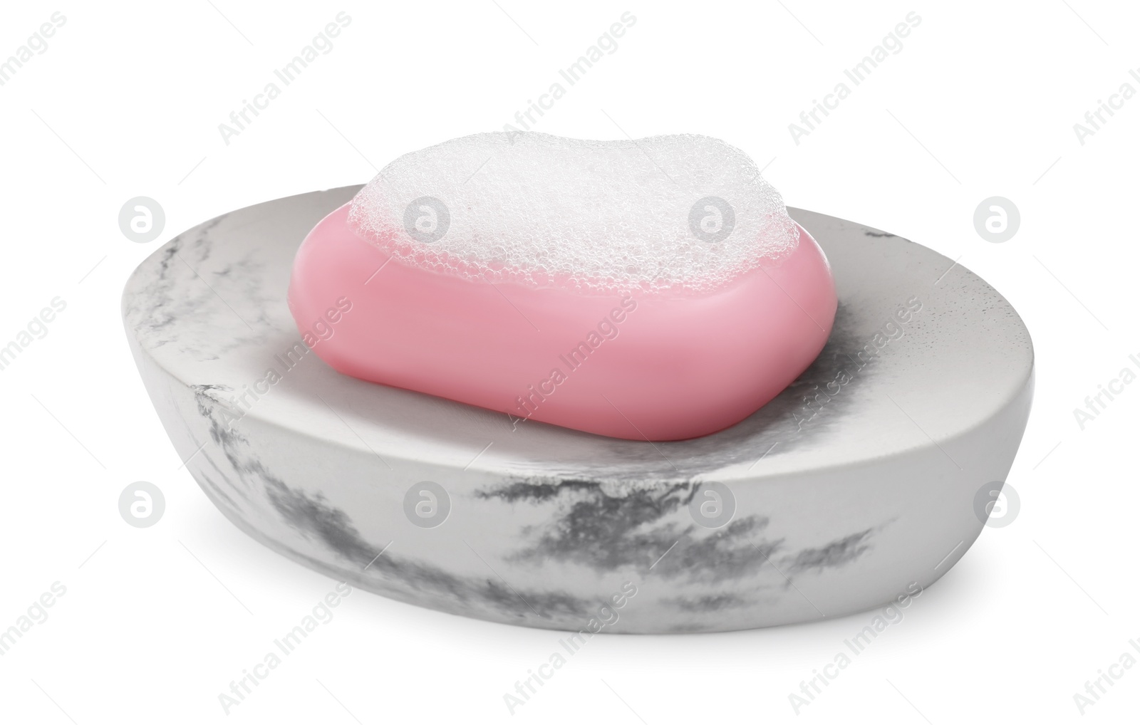 Photo of Soap bar with fluffy foam in holder on white background