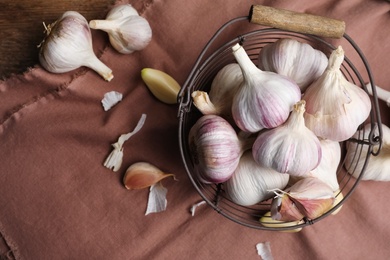 Photo of Fresh organic garlic on table, flat lay