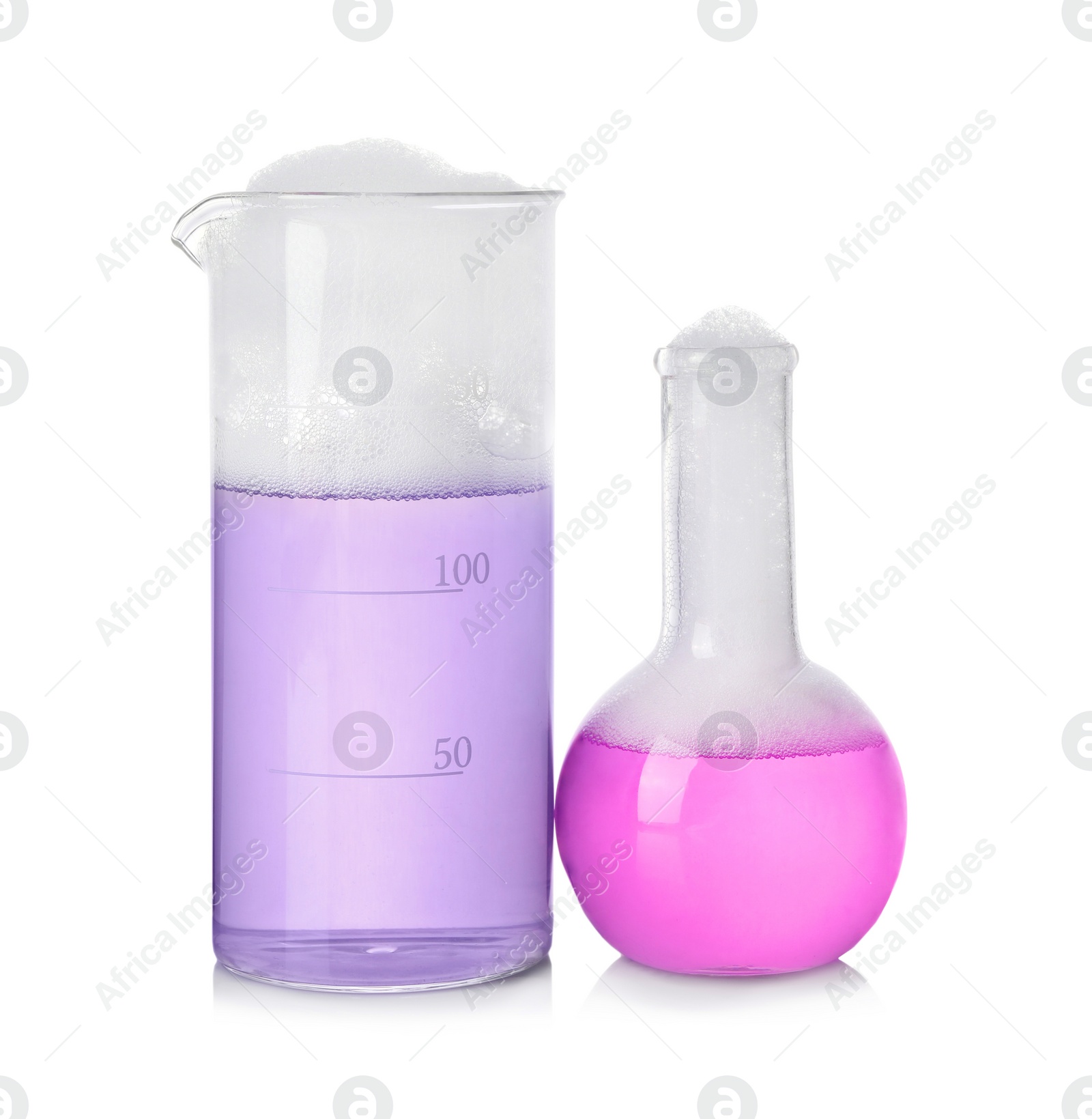 Photo of Laboratory glassware with colorful liquids isolated on white. Chemical reaction