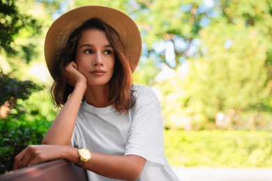 Photo of Portrait of beautiful young woman outdoors on sunny day. Space for text