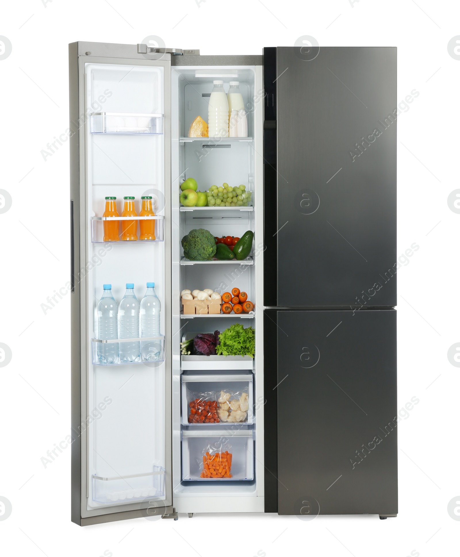 Photo of Open refrigerator filled with products isolated on white