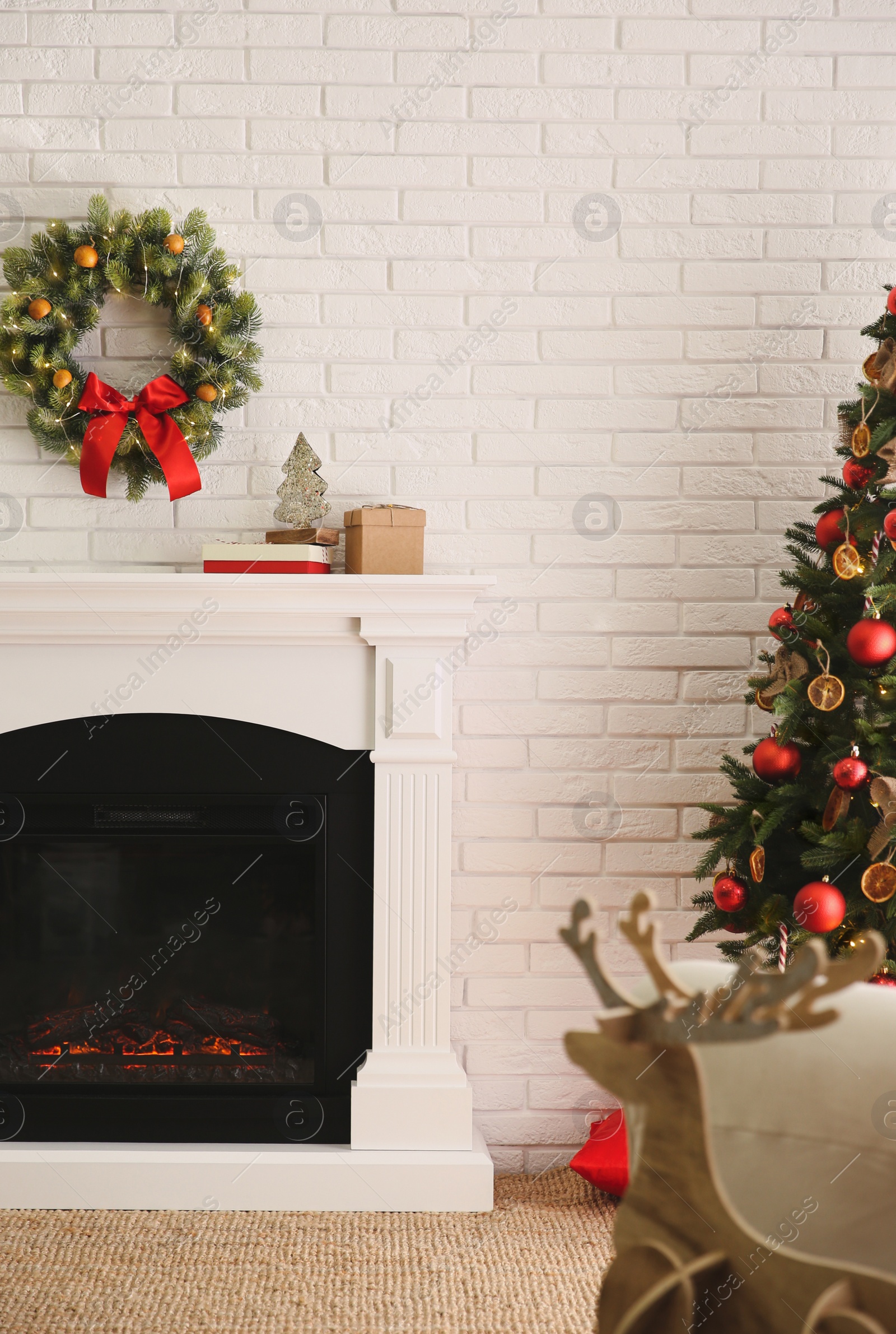 Photo of Modern fireplace in living room decorated for Christmas