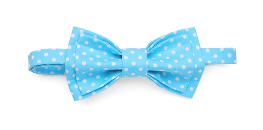 Photo of Stylish light blue bow tie with polka dot pattern on white background, top view