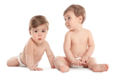 Portrait of cute twin babies on white background