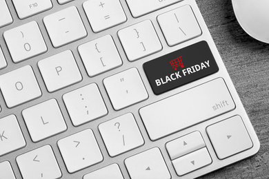 Computer keyboard with Black Friday button, closeup. Online shopping 