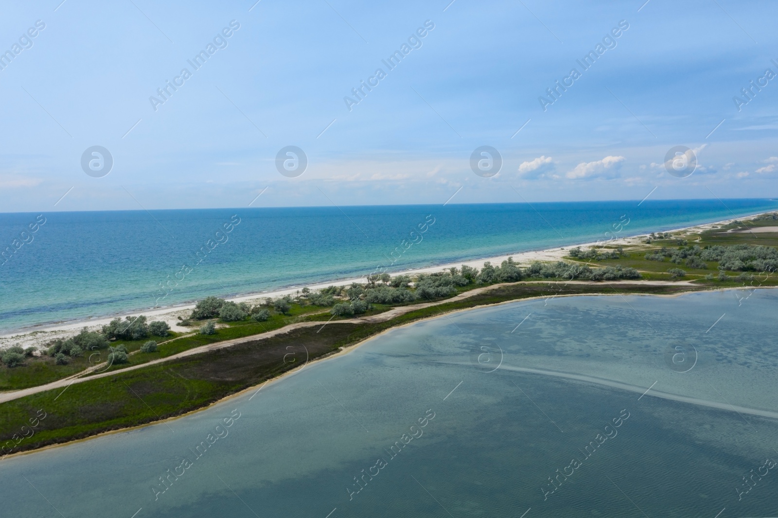 Image of Beautiful aerial view of isthmus with green plants surrounded by sea