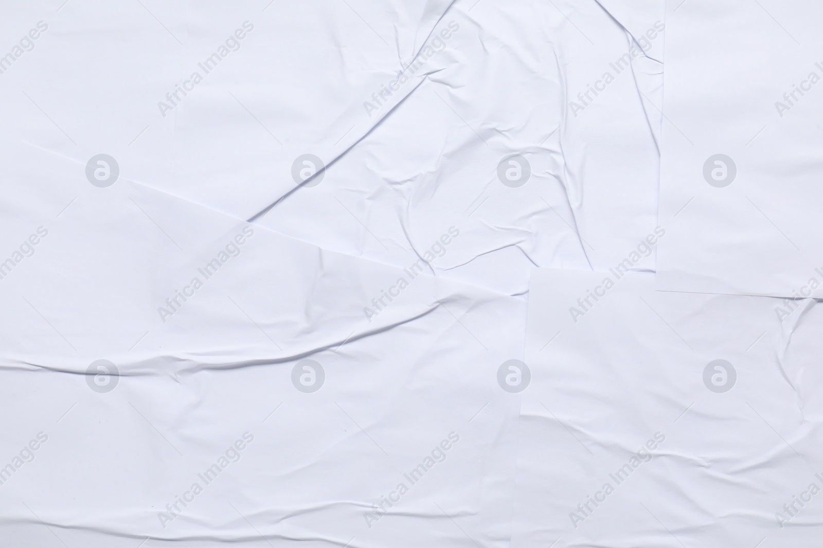 Photo of Texture of white creased paper as background, top view. Wall poster