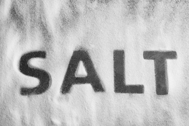 Photo of Word SALT on grey background, top view