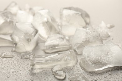 Photo of Pieces of crushed ice on grey background