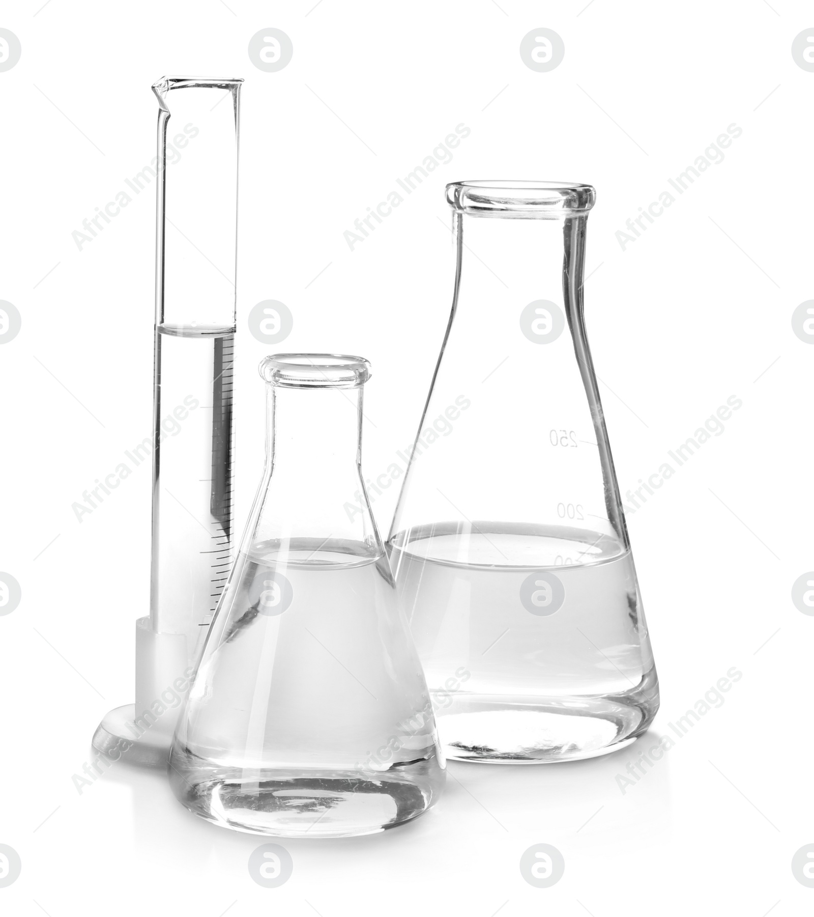 Photo of Flasks with liquid on white background. Laboratory analysis equipment