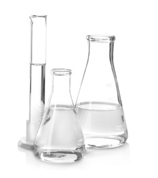 Photo of Flasks with liquid on white background. Laboratory analysis equipment