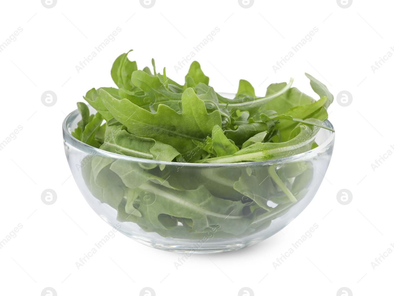 Photo of Delicious fresh arugula on glass bowl isolated on white