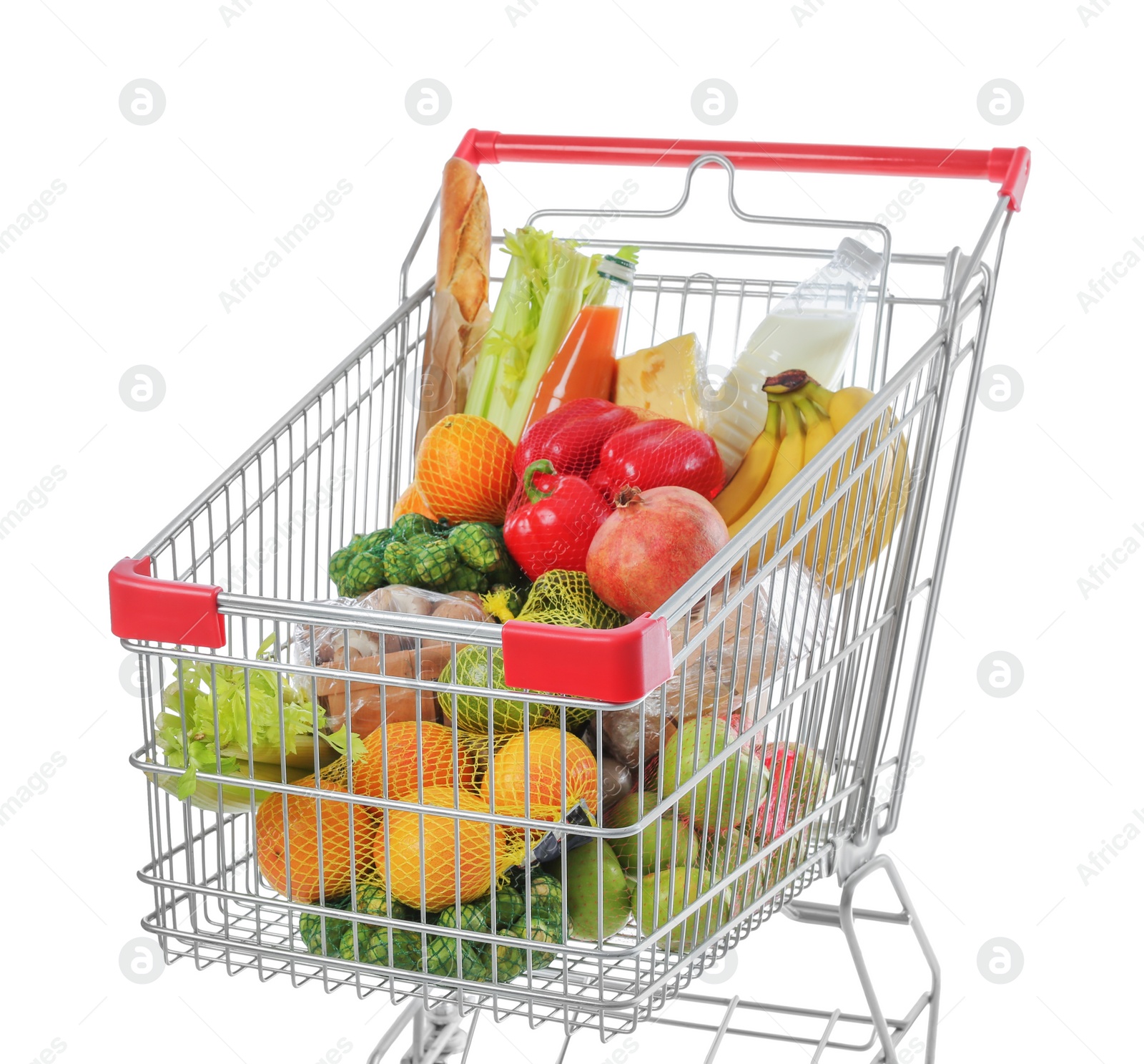 Photo of Shopping cart with fresh groceries on white background