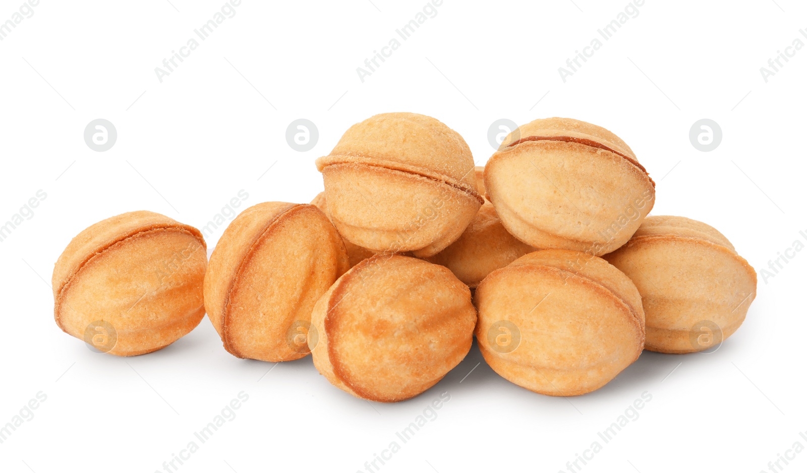 Photo of Delicious nut shaped cookies with condensed milk on white background